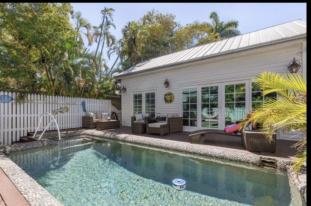 319 Grinnell Street Key West poolside before with plain white French doors