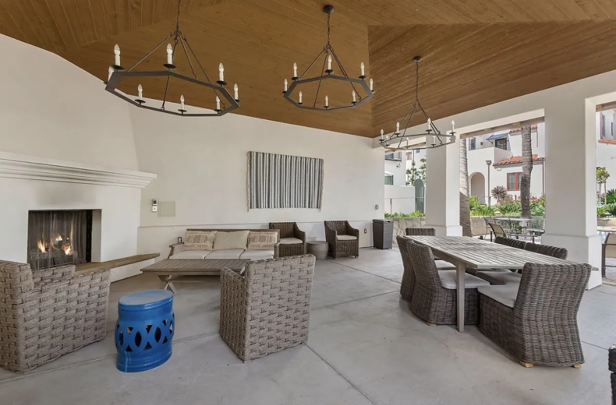 3736 State Street Santa Barbara covered loggia before redesign with dated wicker furniture